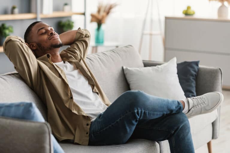 A guy relaxing possibly enjoying some cannabis products